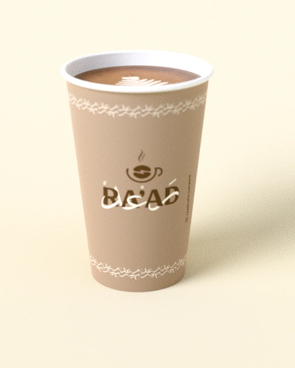 A RA’AD 16 oz paper cup with latte art
